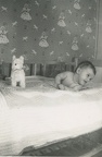 Carole Lee about 3 months in bed trying to roll over