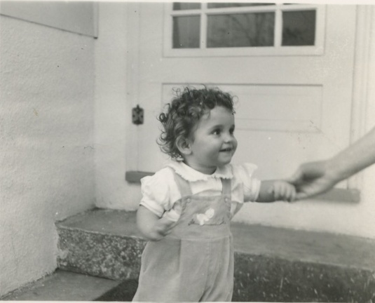 Carole Lee Stanard standing by front door 1941 1