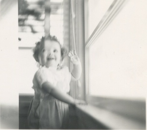 Carole Lee waving by window 1941