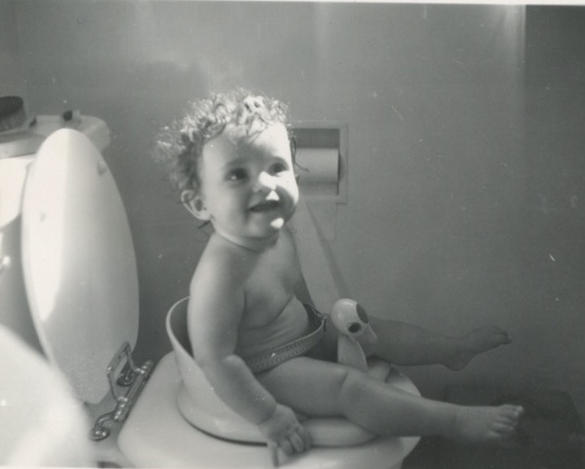 Carole Lee sitting on the toilet chair 1942