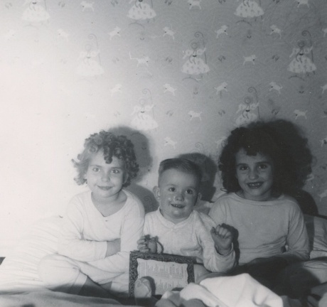 Lynn, Jim and Carole Stanard sitting together in their PJs 1946