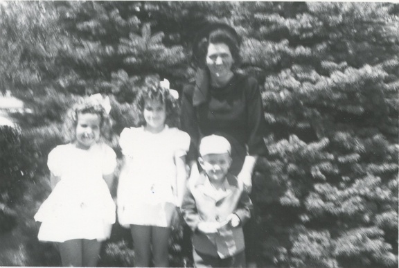 Lynn, Carole, Jim and Cora 1948 out by pine trees
